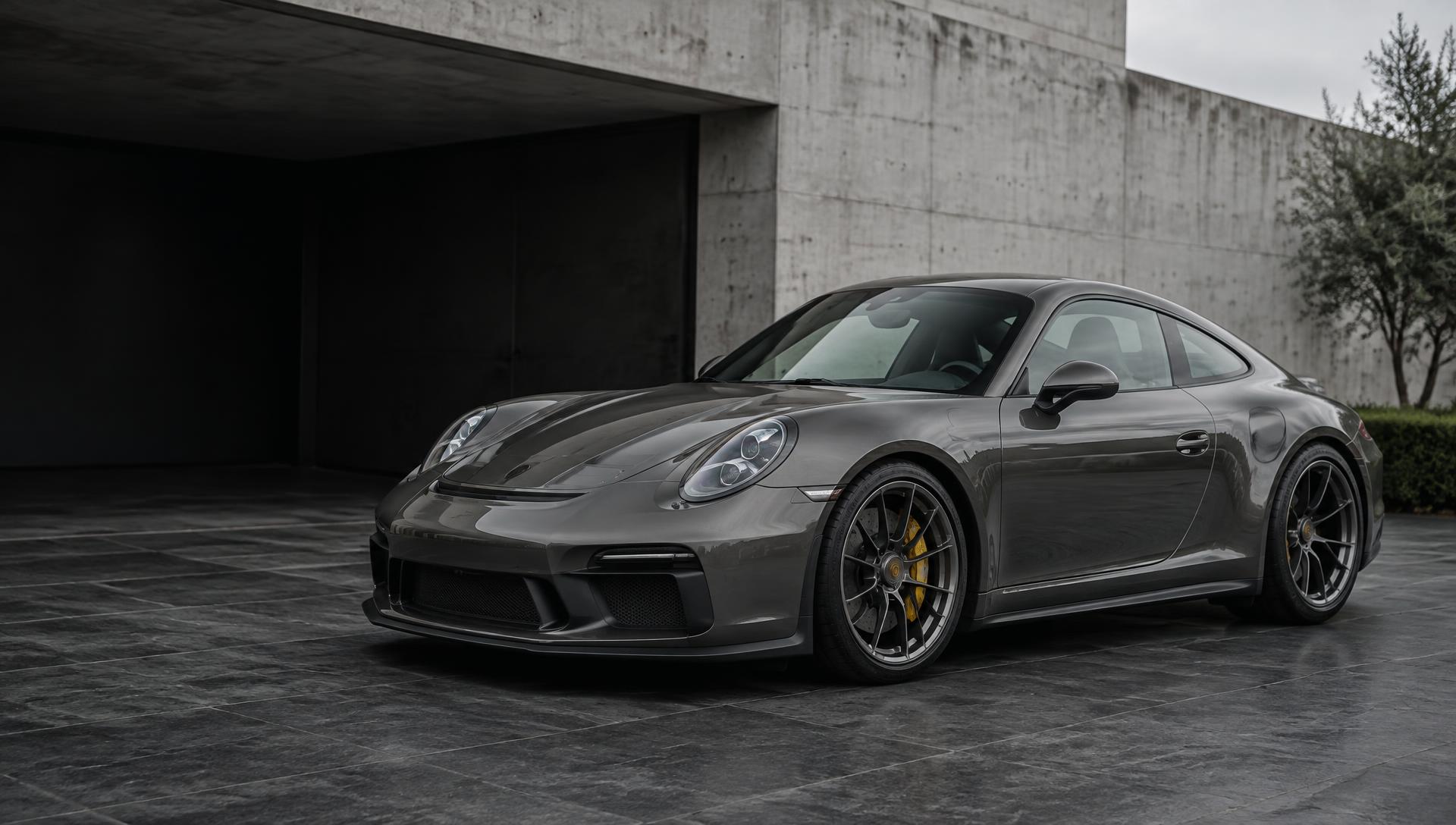 Graphite Porsche 911 in a modern architectural setting